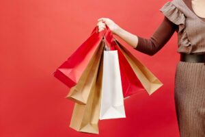 Negocios participando en Buen Fin con promociones y consumidores comprando, reflejando crecimiento económico